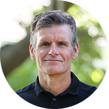 Headshot of Dennis Woodside, President